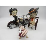 A collection of three unboxed Betty Boop figurines - one arm A/F