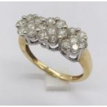A diamond cluster ring set in 18ct gold