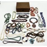 A collection of mainly vintage hardstone and glass jewellery in wooden box