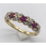 A 9ct gold half eternity style ring set with diamonds and rubies