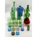 A collection of various coloured glass including bottles, tumblers, Rawlings soda syphon etc.