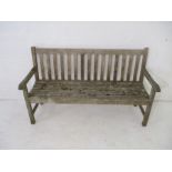 A weathered Regatta garden bench, length 149cm.