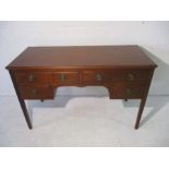 A mahogany Edwardian style desk with four drawers under.