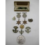 Four WWII medals along with 3 Jellalabad badges, Goblin pen set in original box, silver Chinese