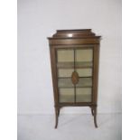 An Edwardian inlaid display cabinet