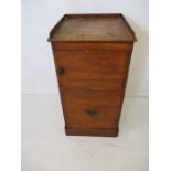 A Georgian mahogany commode with pull out seat and cupboard over