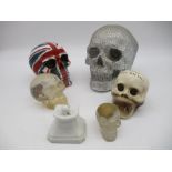A collection of novelty skull ornaments