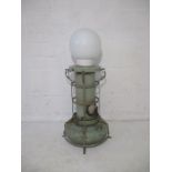 A converted industrial paraffin lamp.