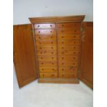 A Victorian pine twenty drawer "specimen" cupboard - height 155cm, width 107cm, depth 54cm