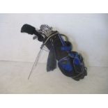 A selection of golf clubs in a Wilson bag, clubs include Calloway Big Bertha irons 3-9, sand wedge