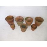 A quantity of terracotta garden pots.