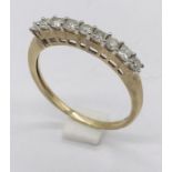 A 9ct gold half eternity ring set with diamonds