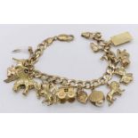 A 9ct gold charm bracelet with various novelty charms including a gypsy caravan which opens to