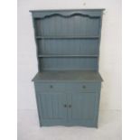 A blue painted pine dresser with two drawers and cupboard under