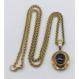 A cabochon garnet pendant set in 9ct gold with 9ct chain, total weight 14.2g