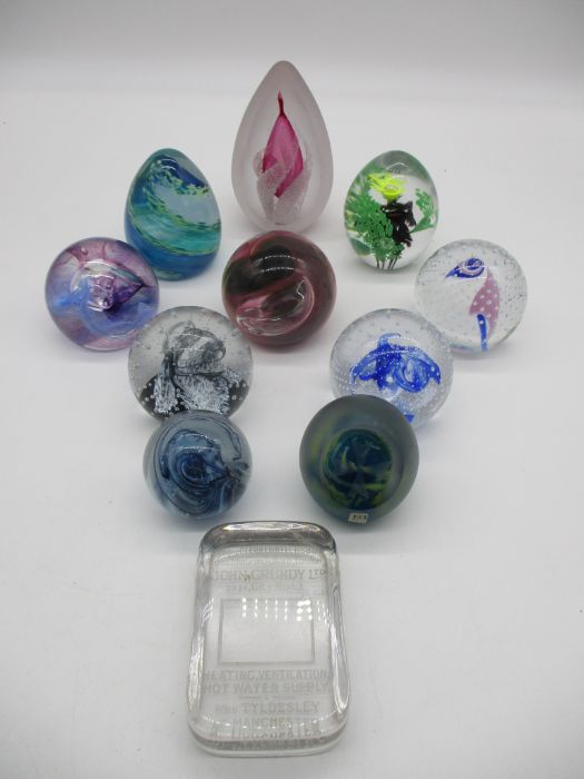 A collection of signed paperweights including Caithness, Mdina, Svaja etc.