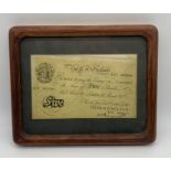 A framed Bank of England £5 five pound note, dated 28th March 1947, signed by Chief Cashier