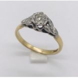 An 18ct gold illusion set diamond solitaire ring