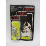 A Palitoy Star Wars Return Of The Jedi "AT-AT Driver" figurine in original packing with trilogo. (