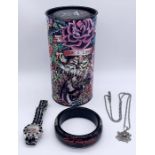 An Ed Hardy Tattoo watch, bangle, pendant and candle