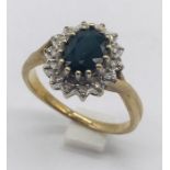 A diamond and sapphire cluster ring set in 9ct gold