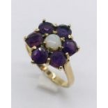 A 9ct gold cluster ring set with garnets and opal