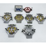 A collection of AA badges along with an RAC badge and Institute of Advanced Motorists badge.