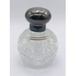 A silver mounted scent bottle