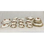 A collection of Royal Albert Country roses tea and dinner service including six trios, six bowls,