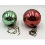 Two red and green glass witches balls