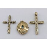 Two 9ct gold crosses along with a 9ct gold locket set with an aquamarine, total weight 6.6g