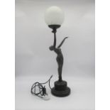 An Art Deco style lamp, in the form of a lady, standing.