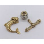 Three 9ct gold items including charm, pendant etc. total weight 3.2g