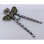 A large 925 silver dragonfly pendant set with an opal