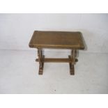 An oak occasional table with swivel top.