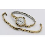 A 9ct gold ladies watch, the white enamelled dial signed "Hallett, Sturminster Newton", along with