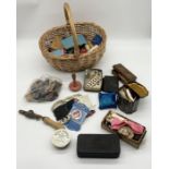 A collection of vintage sewing equipment in wicker basket