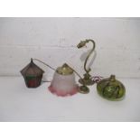 A small collection of Victorian and antique lighting, including a cranberry glass shade (slight