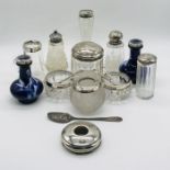A collection of silver mounted pots, salts and vases etc.