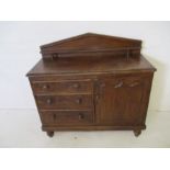 A Northumberland pine dresser base with three drawers and cupboard