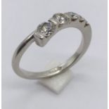 A platinum (950) diamond five stone ring set with graduated stones. Total weight 4.1g.