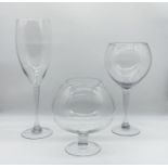 Three oversized novelty glasses