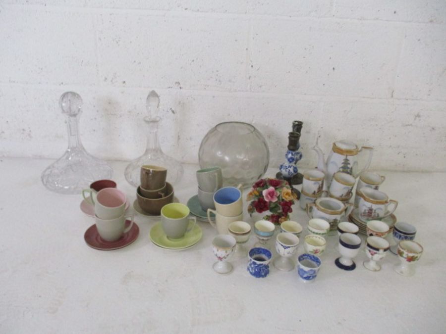 A quantity of china and glass, including a Japanese style coffee set, decanters, fifteen egg cups