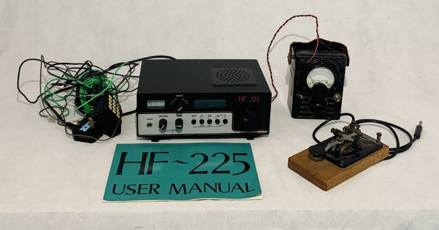 A Europa HF-225 short wave receiver along with a Morse Code key etc.