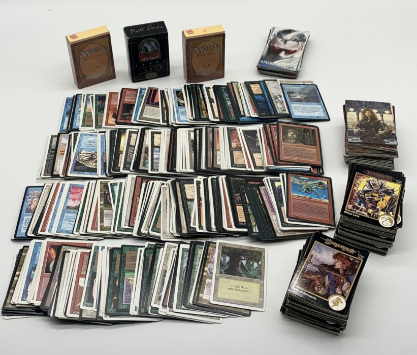 A large collection of Magic the Gathering playing cards including two revised edition starter pack