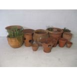 A quantity of terracotta garden pots.