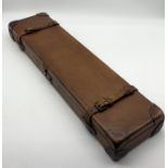 A leather gun case with felt lined interior and label for Churchill, Atkin, Grant & Lang Ltd -