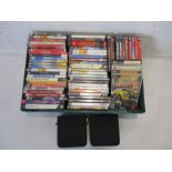 A large collection of PC games, along with two carry cases