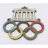 A 1936 Berlin Olympic metal and coloured enamel badge
