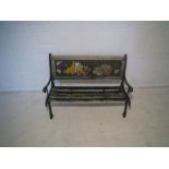 A childs garden bench, with painted cast iron ends and back and wooden slatted seat, length78cm,